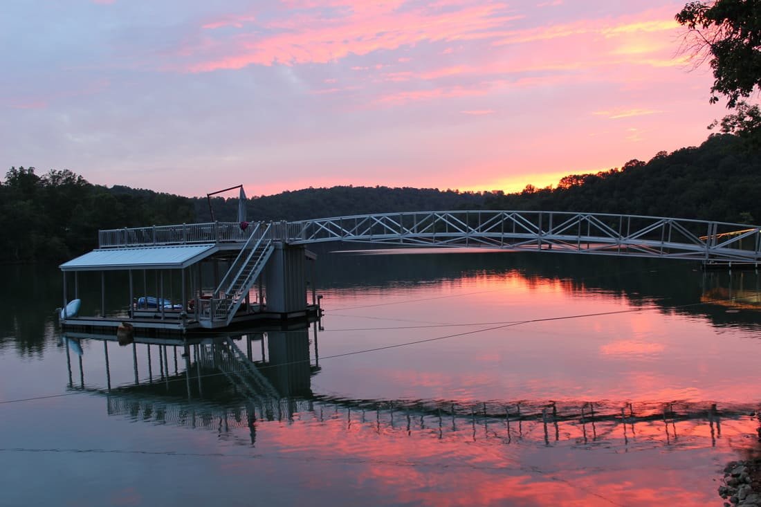 Sunset behind a dock over Norris Lake in Norris, Tennessee